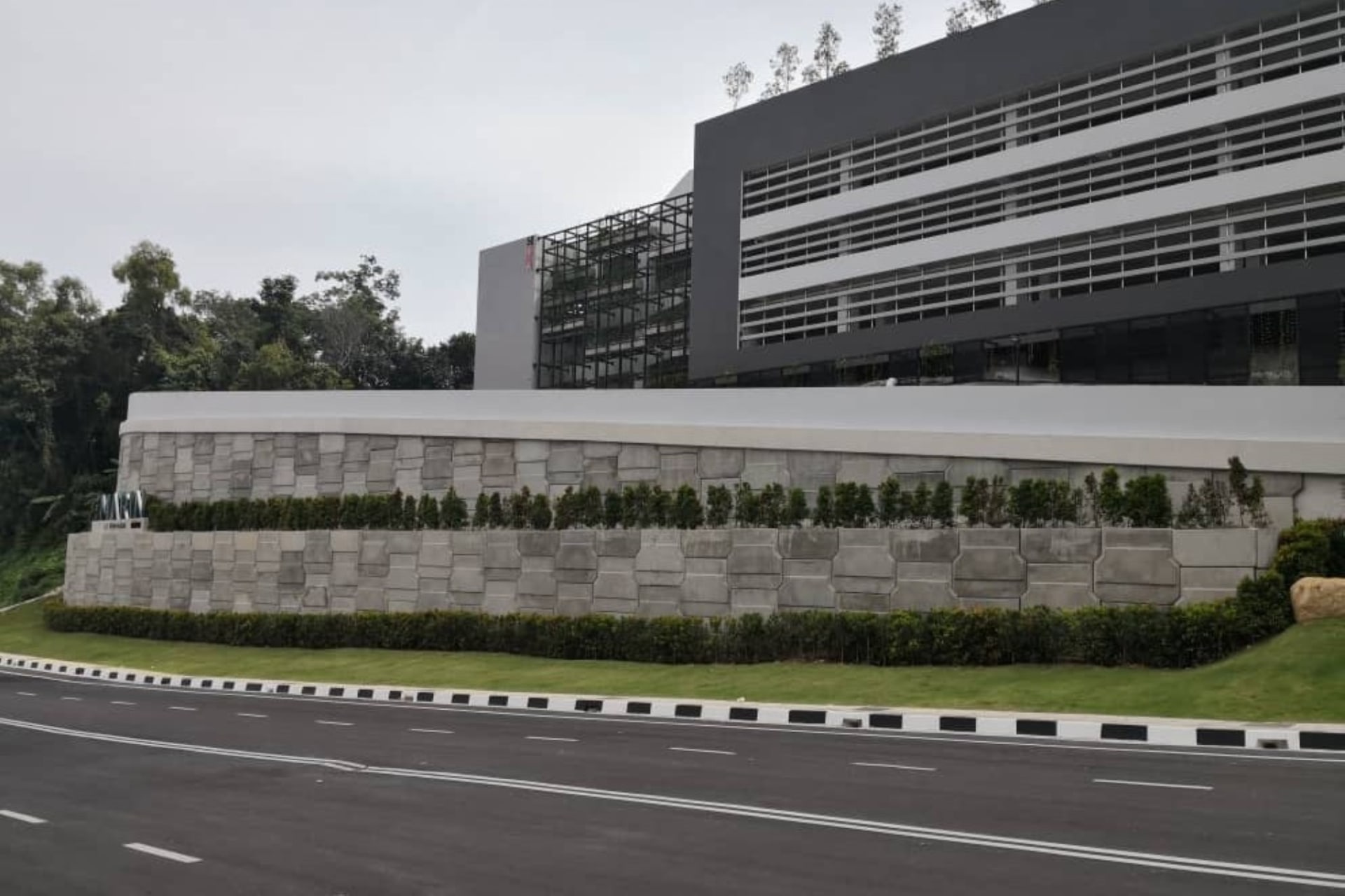 AnchorSOL wall with architectural finish and custom logo cast into precast panel
